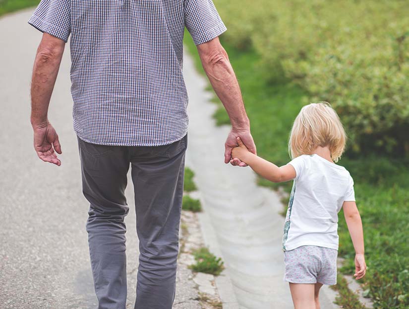 Father and son walking holding hands needing Childrens Matters Blackpool services